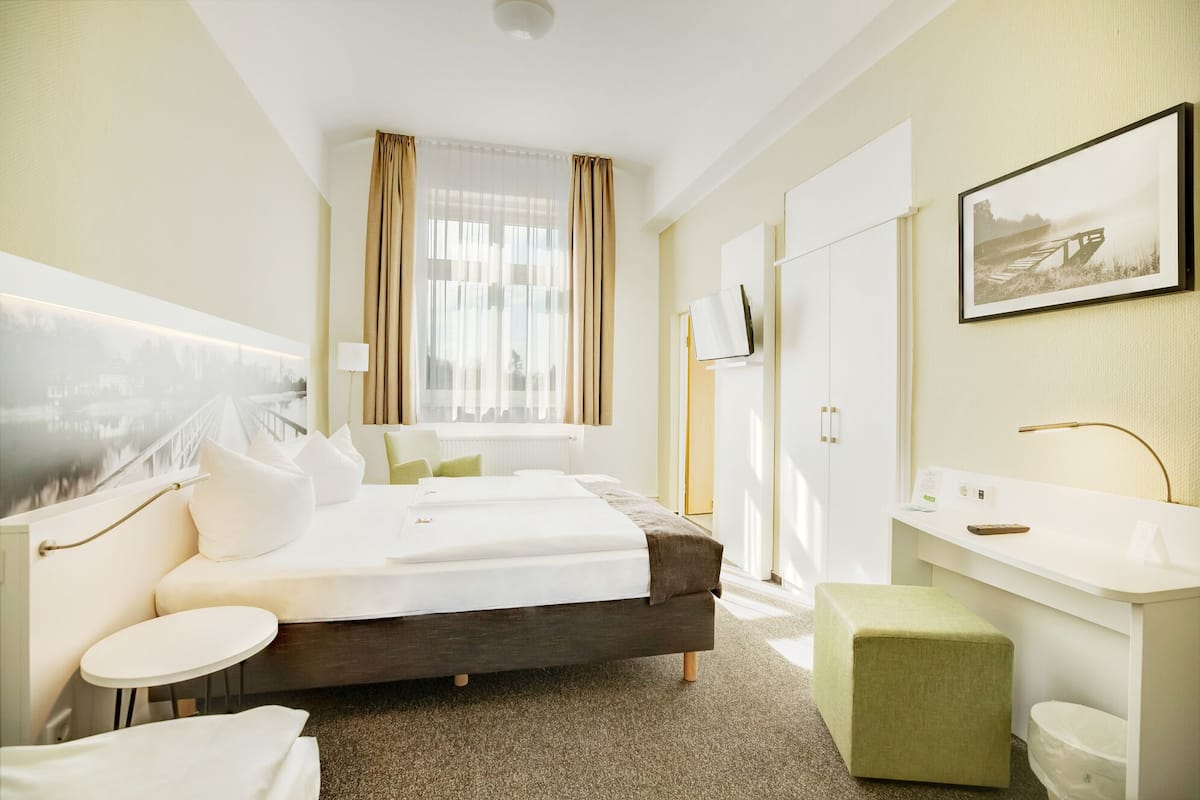 standard double room | living area | flat-screen tv