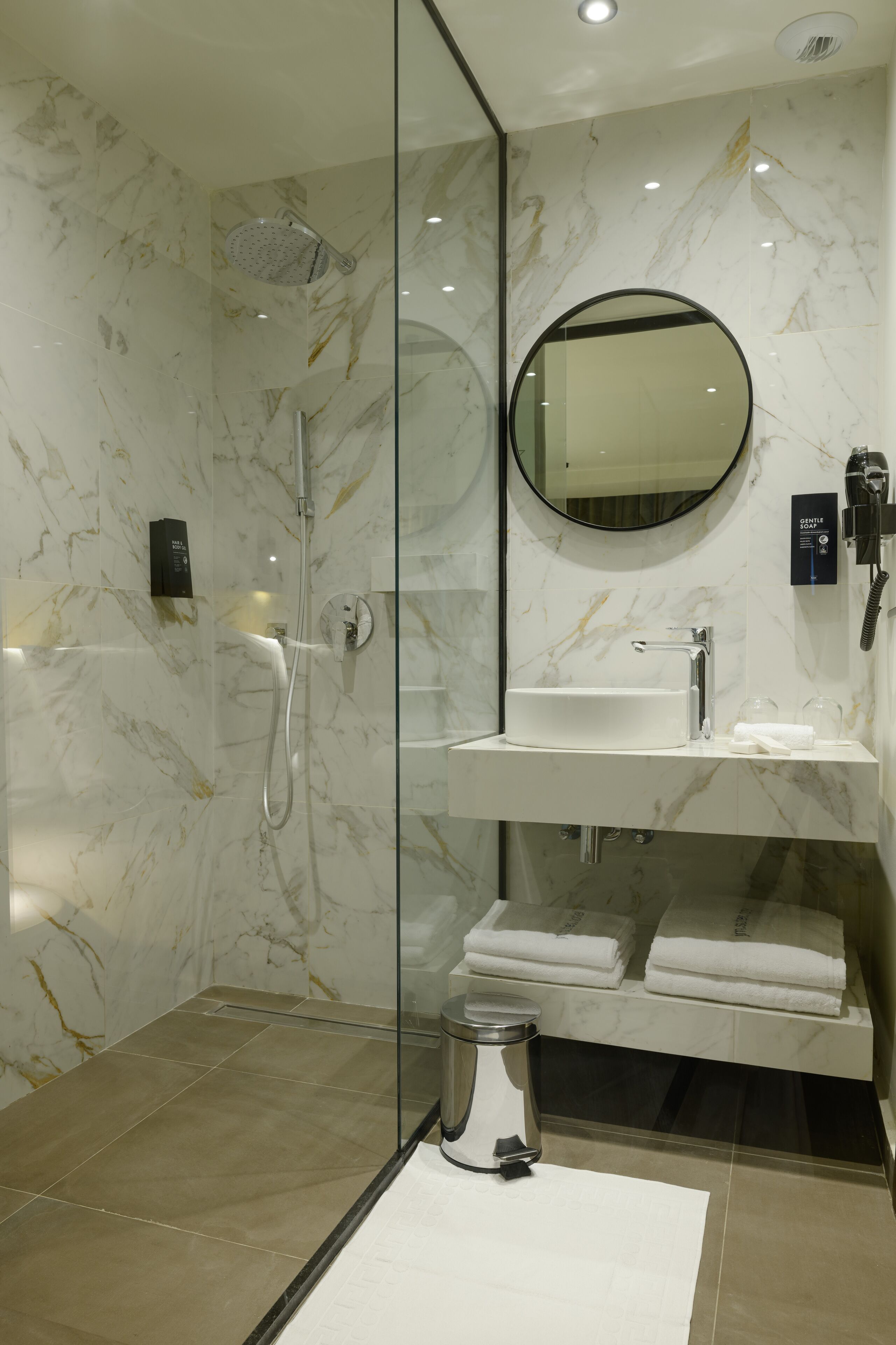 Shower, rainfall showerhead, designer toiletries, hair dryer