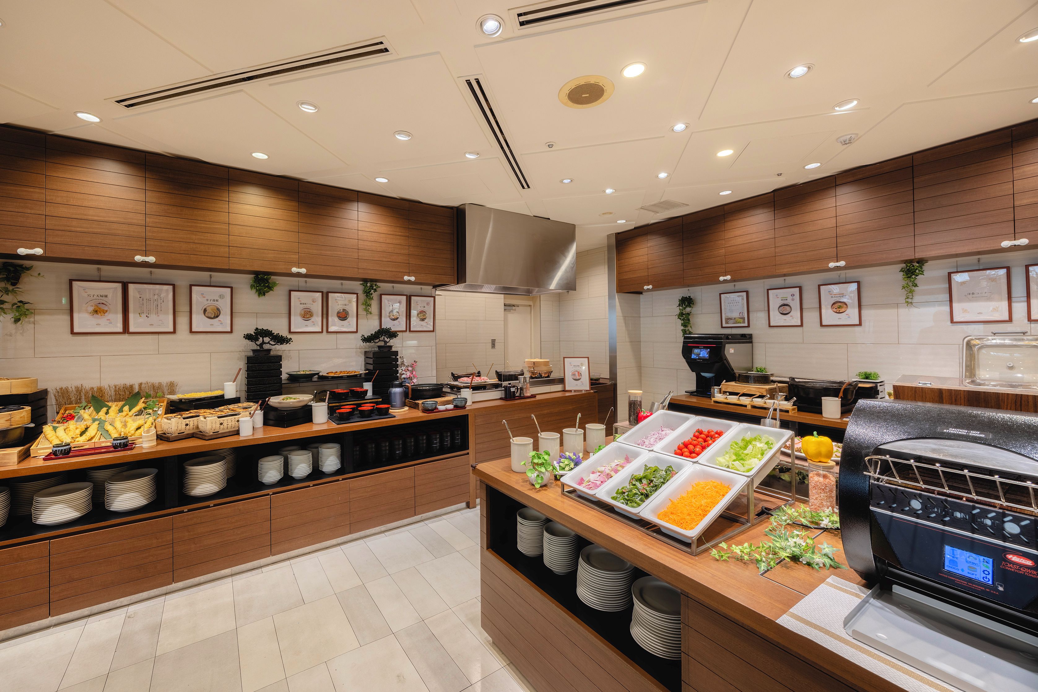 A buffet area with various food items and a self-service grill station.