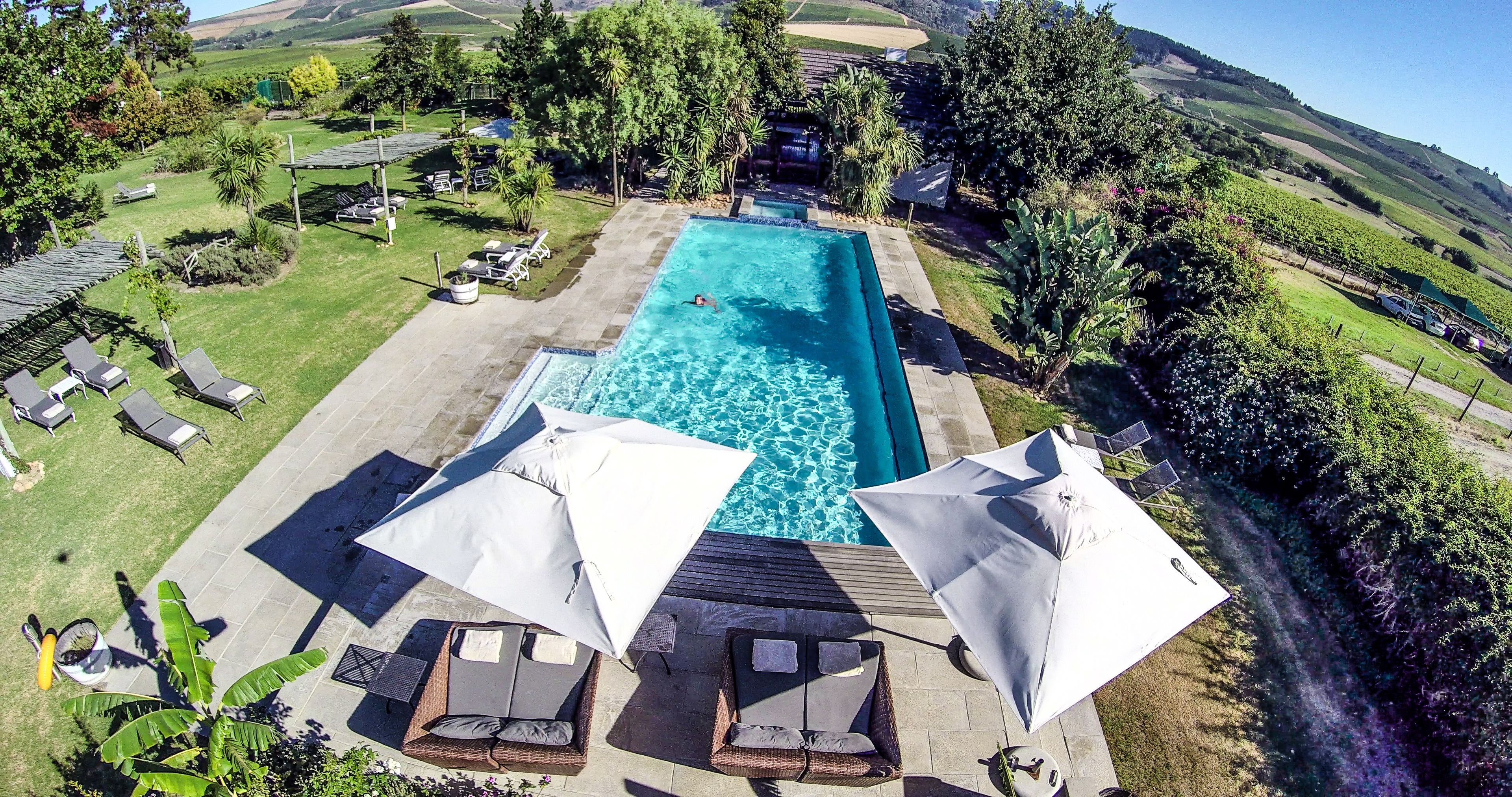 2 outdoor pools, pool umbrellas, pool loungers