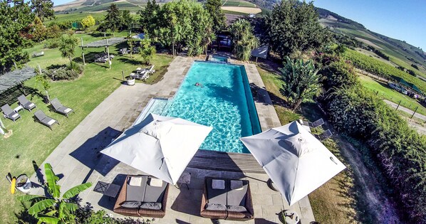 2 outdoor pools, pool umbrellas, pool loungers