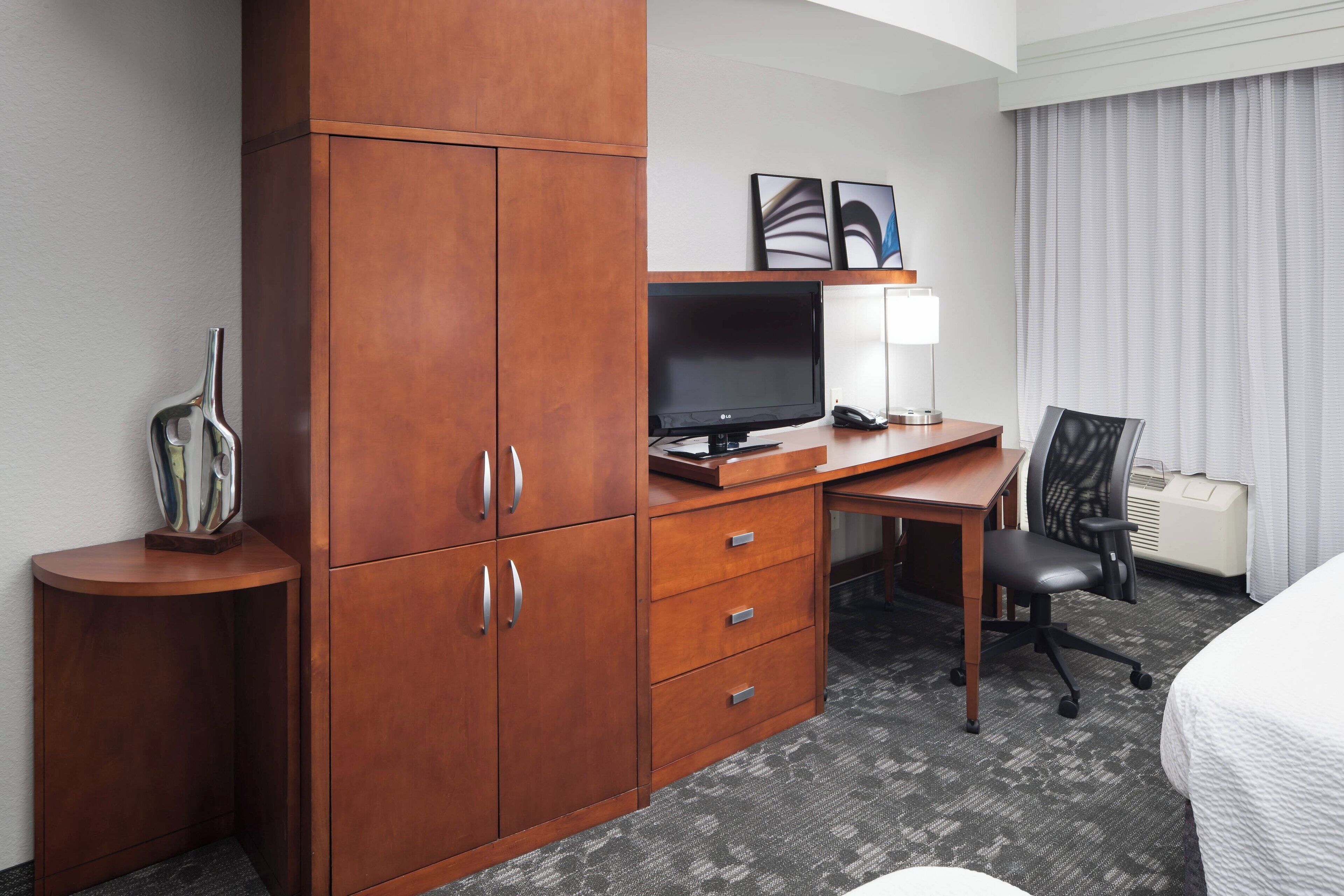 premium bedding, desk, laptop workspace, iron/ironing board