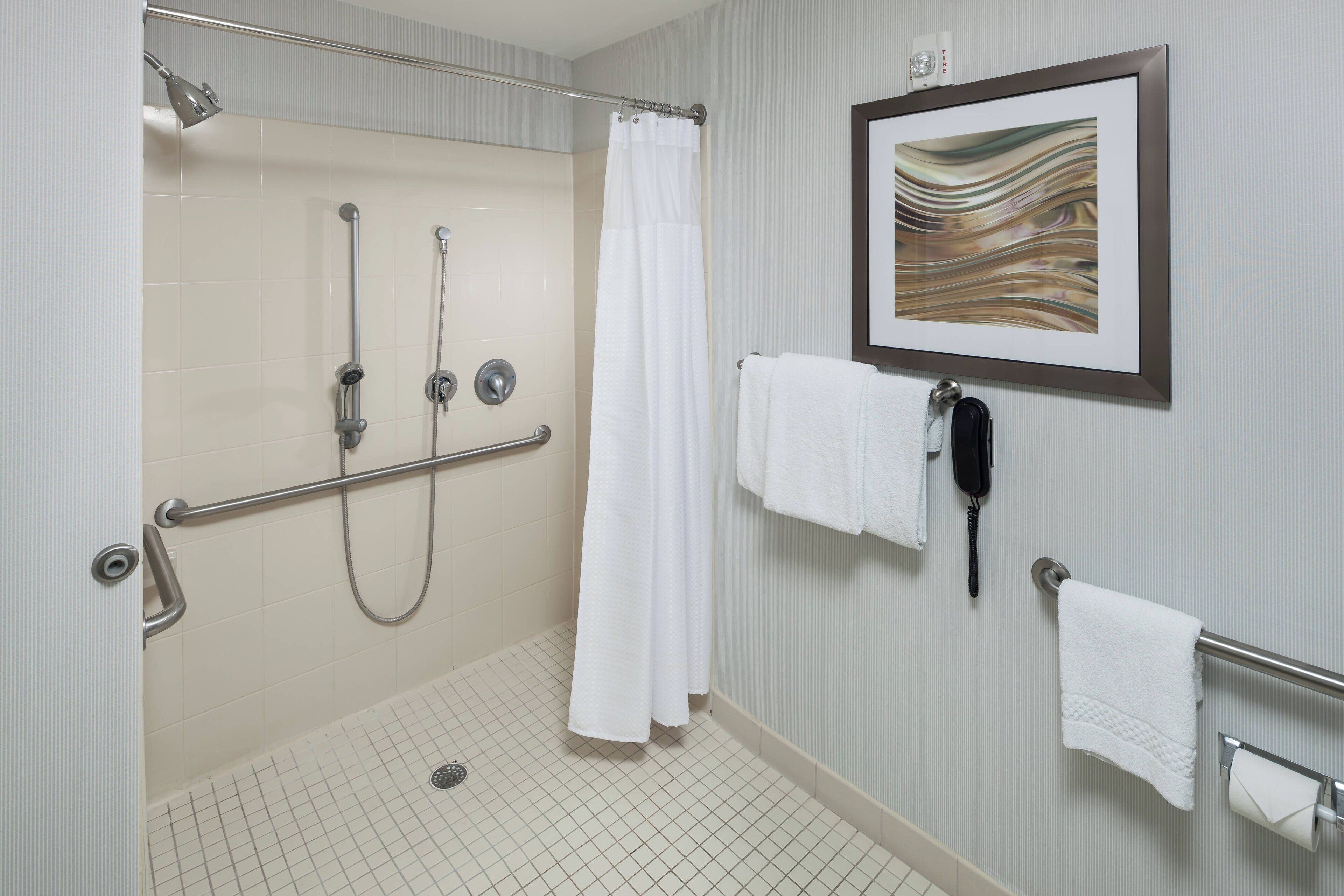 combined shower/bathtub, free toiletries, hair dryer, towels