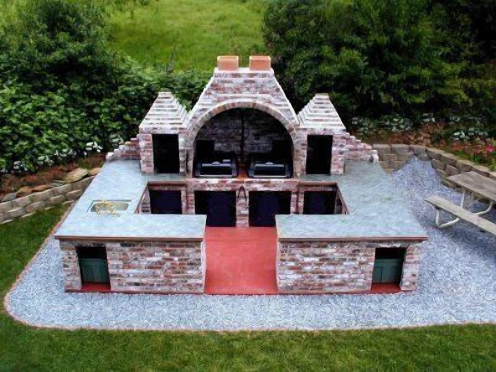 A stone barbecue structure with a central chimney, two side chimneys, and a red carpet leading to the entrance.