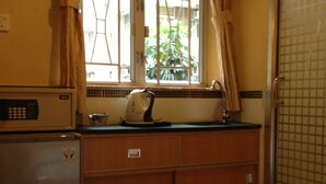 Habitación familiar, 2 camas matrimoniales | Café y/o cafetera