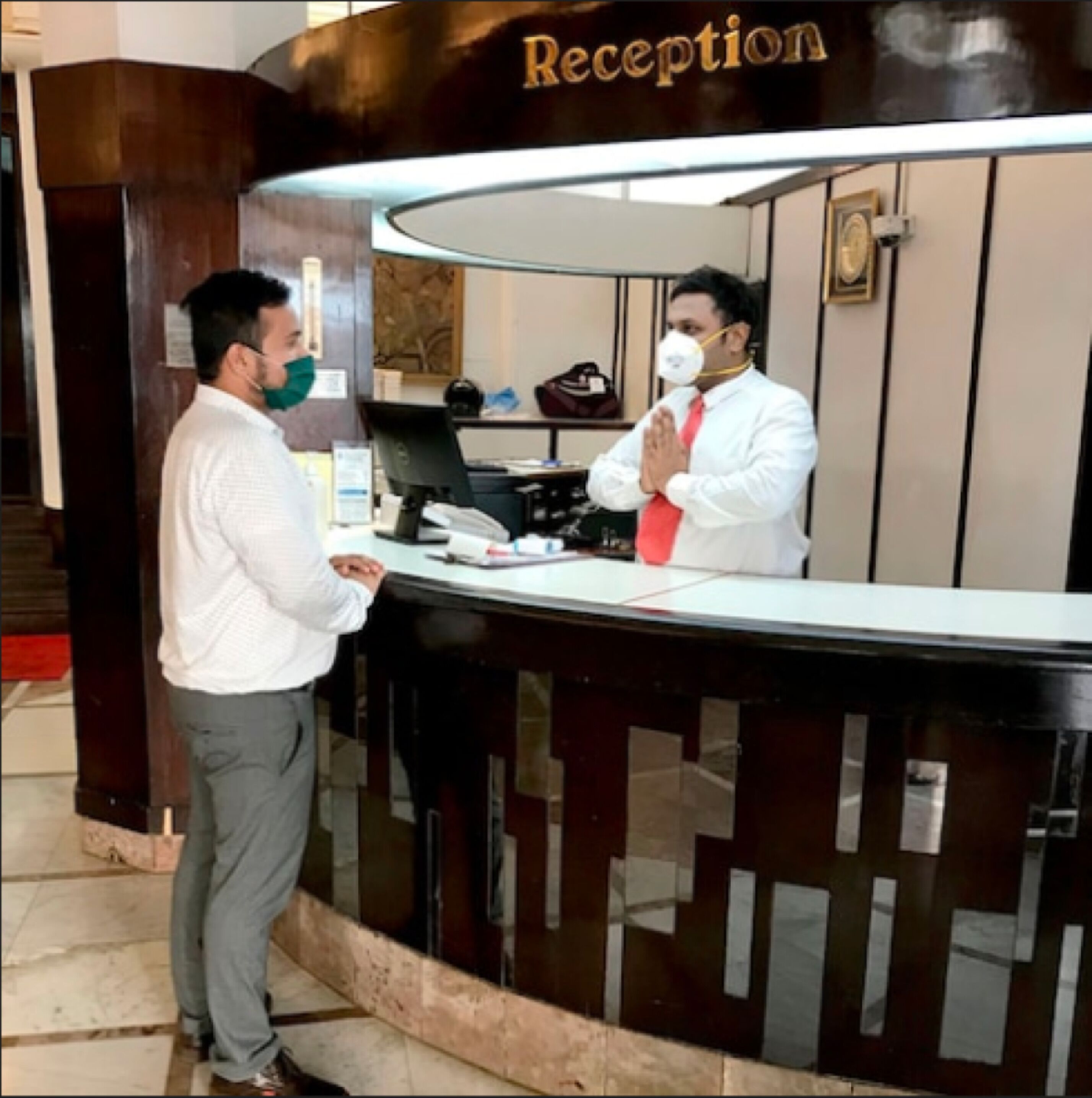A reception desk with a sign above it that reads "Reception".