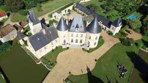 A large, historic castle with multiple towers and a central courtyard. - Chateau De Vauloge (Ferce-sur-Sarthe)