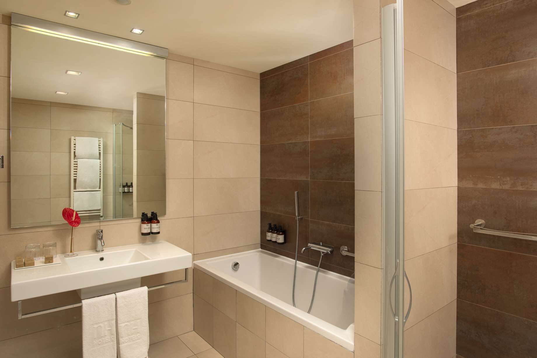 combined shower/bathtub, rainfall showerhead, eco-friendly toiletries