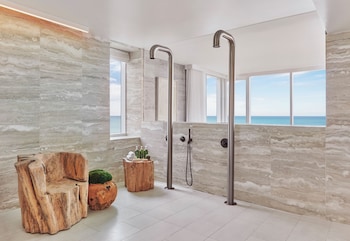 Presidential Suite | Bathroom | Deep soaking tub, rainfall showerhead, designer toiletries, hair dryer at 1 Hotel South Beach