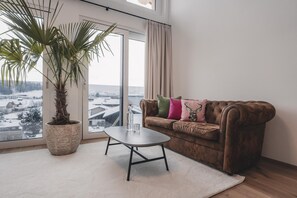 Suite (Garten-Glück) | Oppholdsområde | En 45-tommers TV med kabel-kanaler samt leker