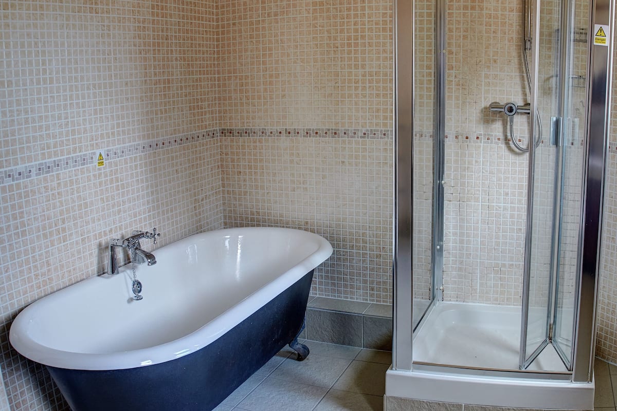 superior double room | bathroom | free toiletries, hair dryer, towels