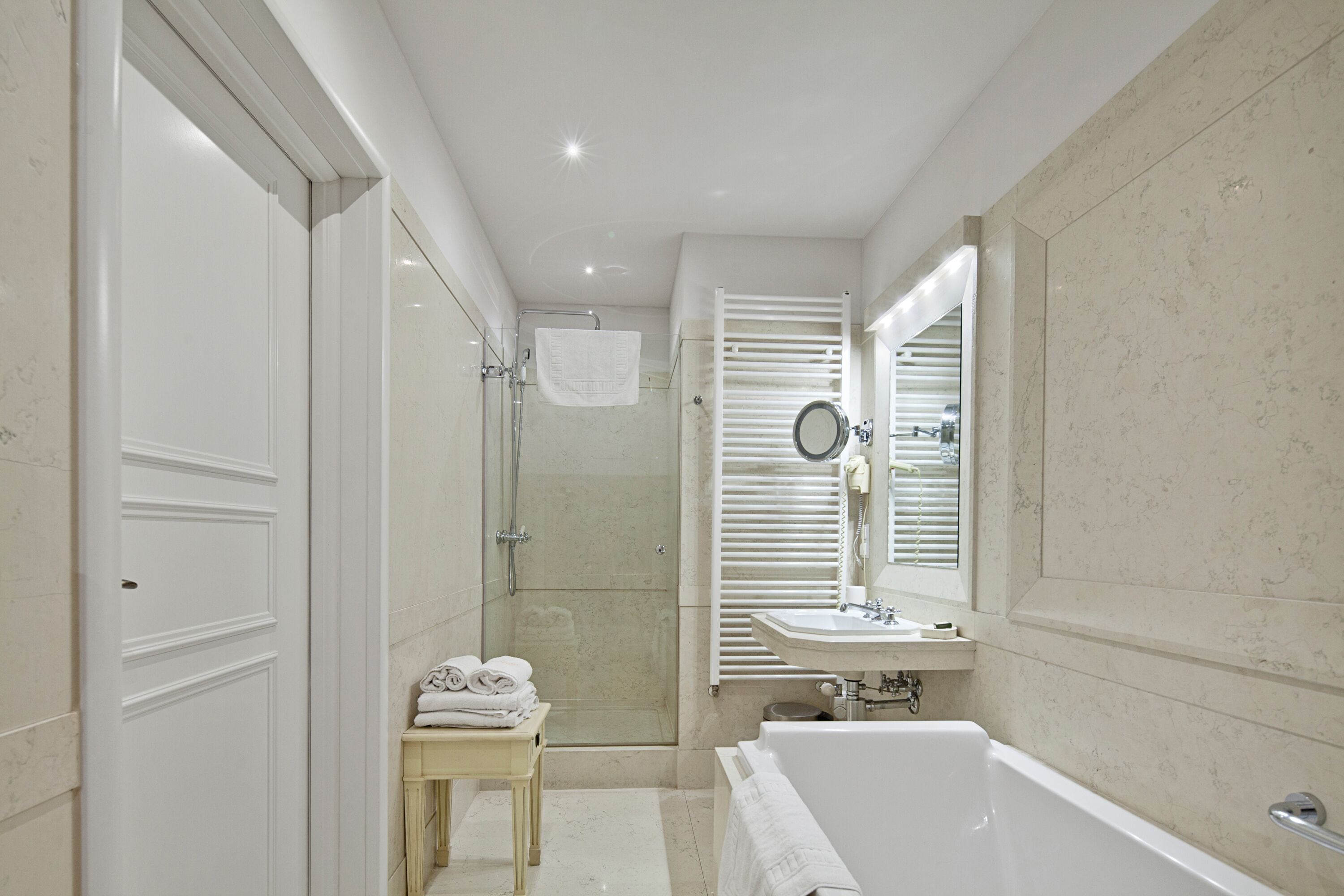 executive suite | bathroom | combined shower/bathtub, designer toiletries, hair dryer, bathrobes