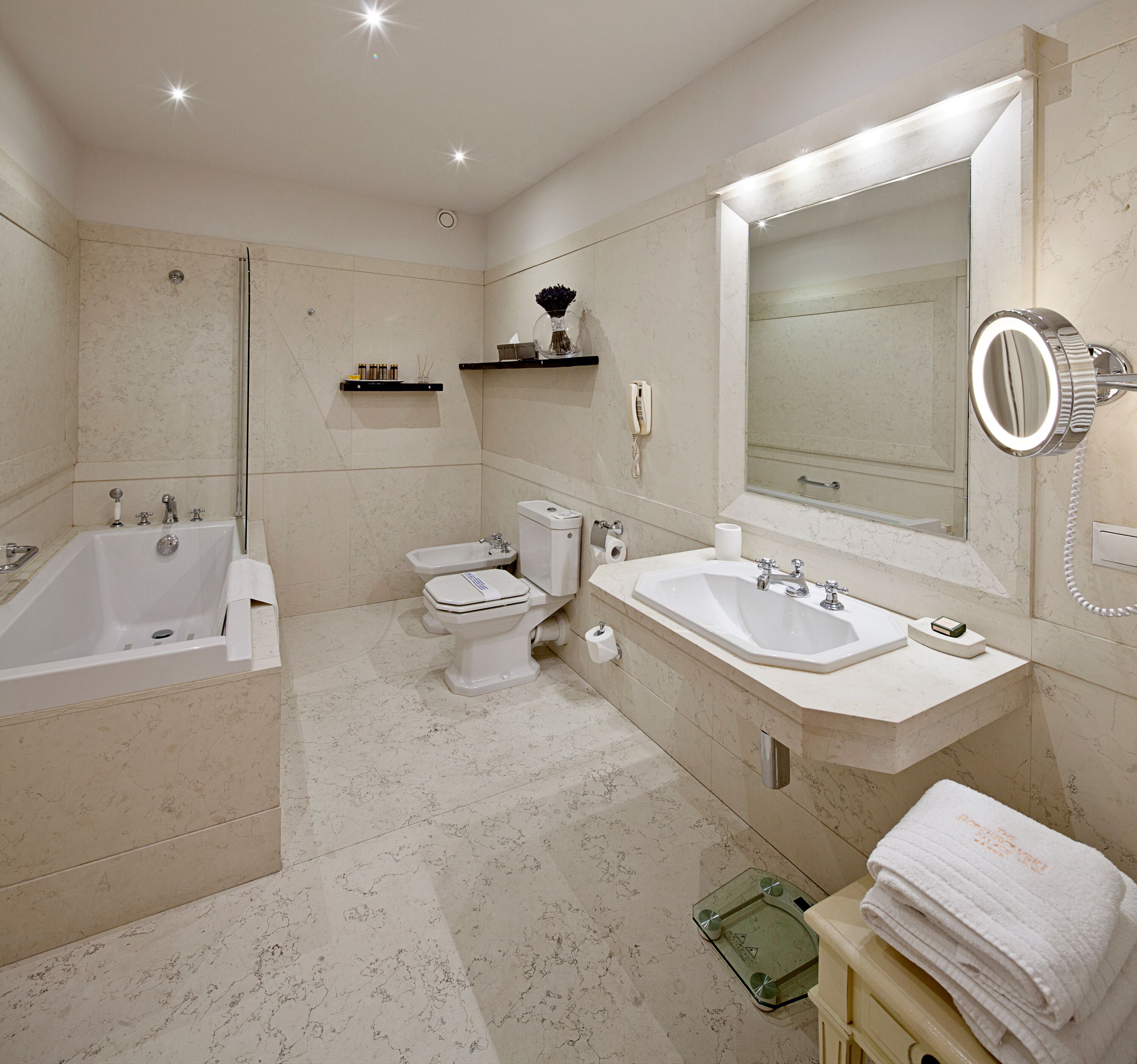 luxury apartment, city view | bathroom | combined shower/bathtub, designer toiletries, hair dryer, bathrobes