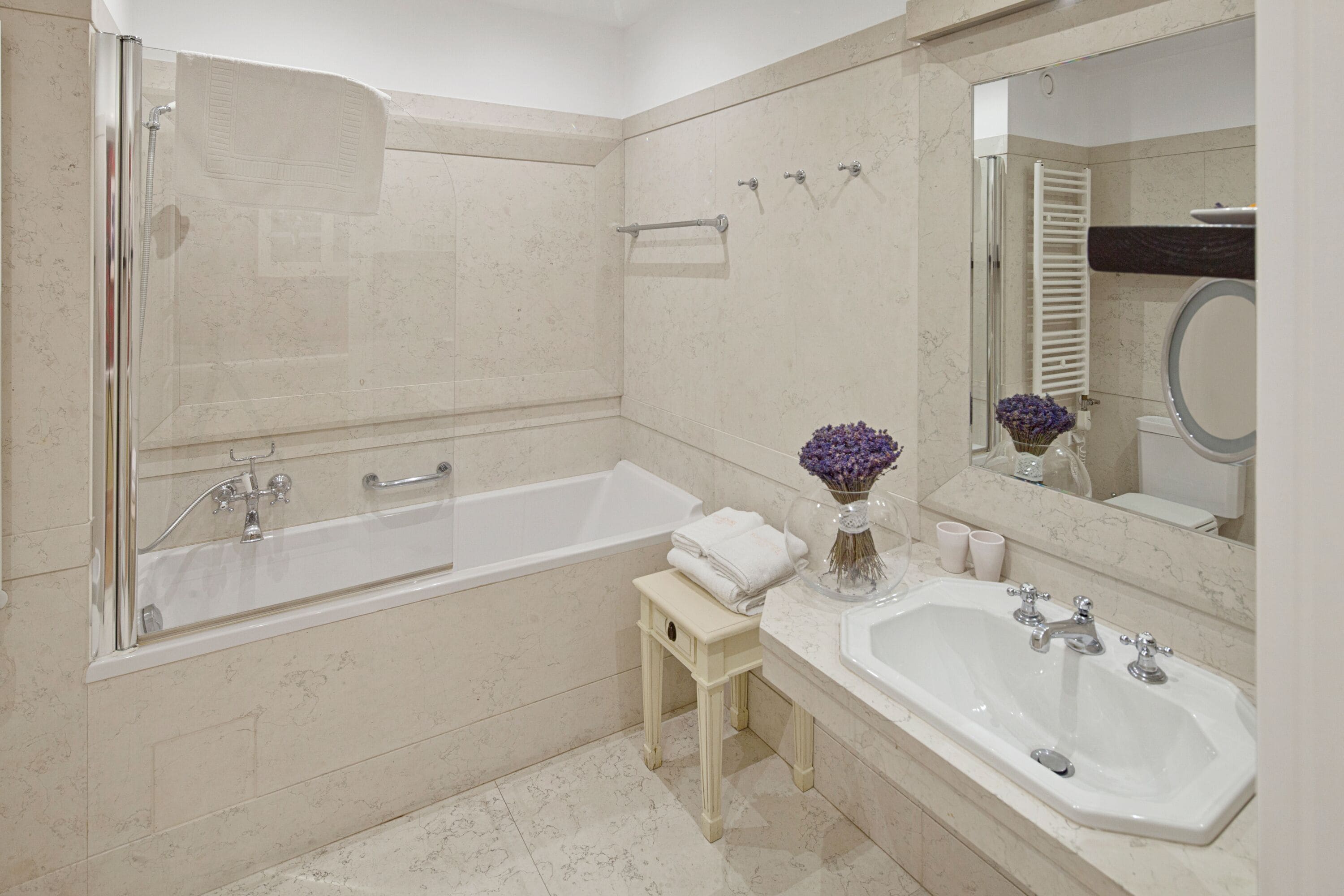 combined shower/bathtub, designer toiletries, hair dryer, bathrobes