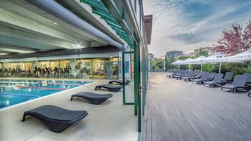 Indoor pool, pool umbrellas, pool loungers