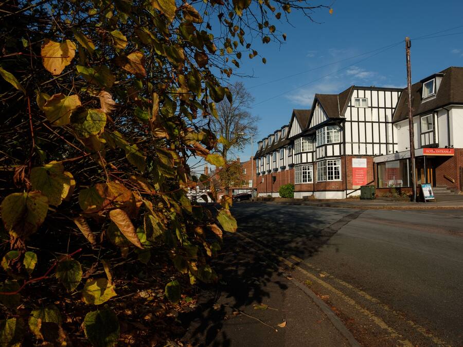 A traditional half-timbered building with a sign for 'Hotel Innance'.