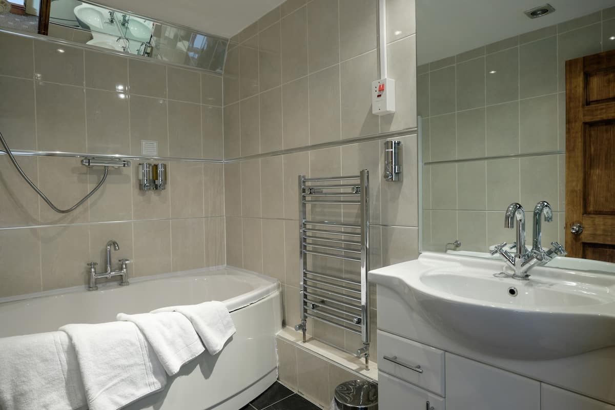 premier double room | bathroom | hair dryer, towels