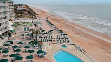 Indoor pool, outdoor pool, pool umbrellas, pool loungers