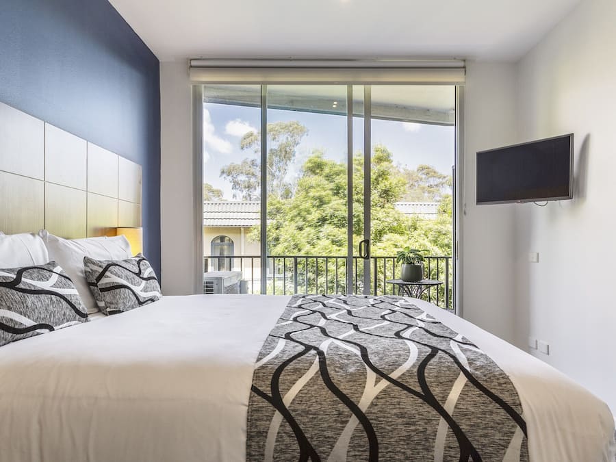 Desk, laptop workspace, iron/ironing board, cribs/infant beds