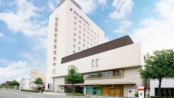 Situated on a street corner, Quintessa Hotel offers easy access and a well-maintained exterior with landscaped areas.