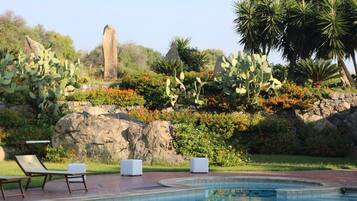 Outdoor pool, open 9:00 AM to 7:30 PM, pool loungers