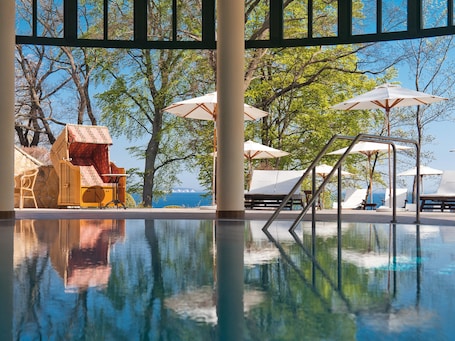 Indoor pool, open 7:00 AM to 10:00 PM, sun loungers