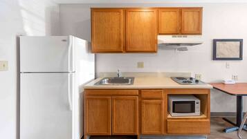 Full-size fridge, microwave, stovetop, freezer