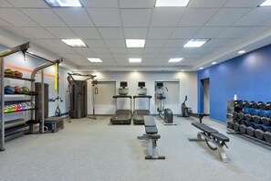A gym with various exercise equipment including treadmills, weight machines, and free weights. - Hampton Inn Corsicana (Corsicana)