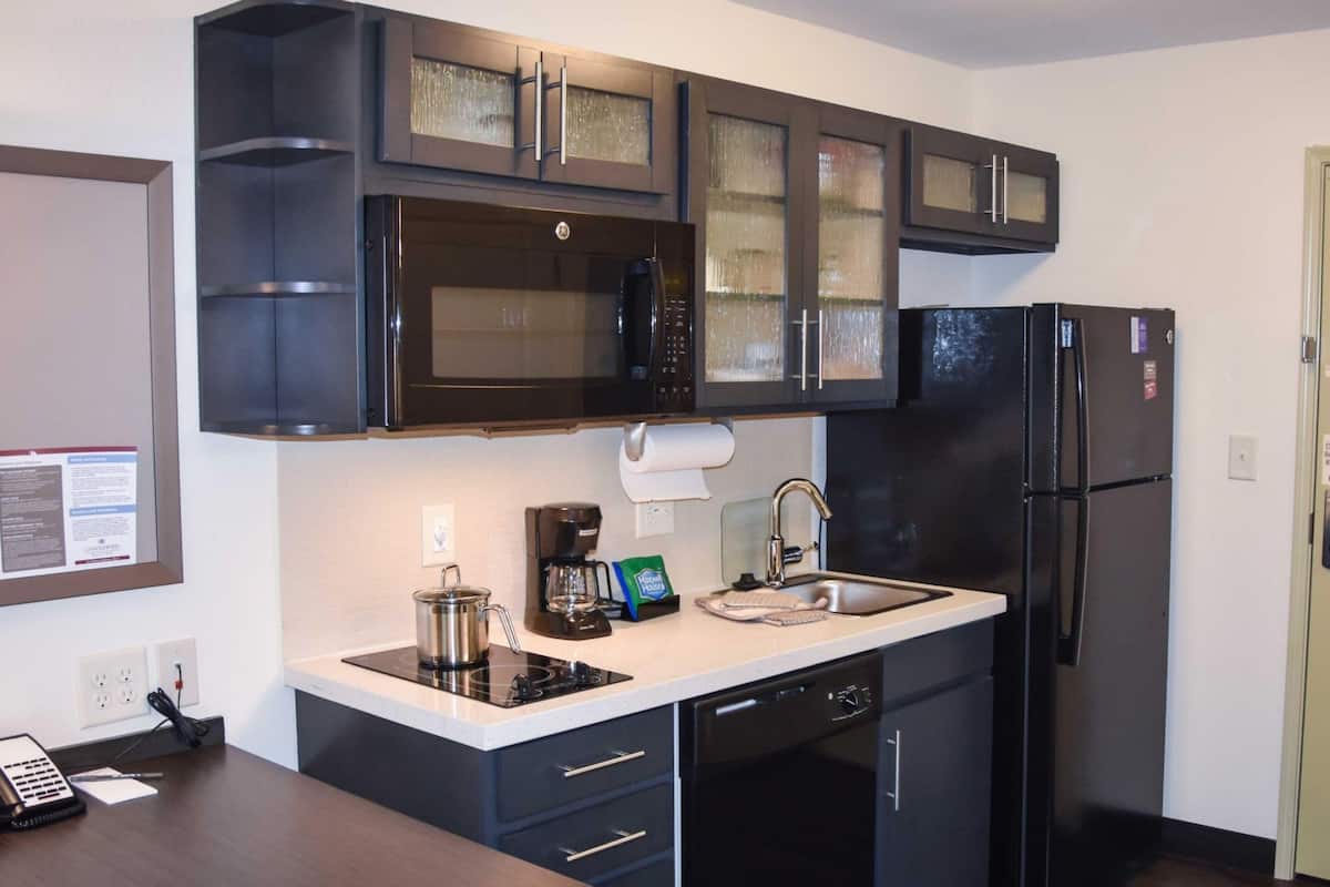 Coffee/tea maker, fridge, microwave, cookware/dishes/utensils