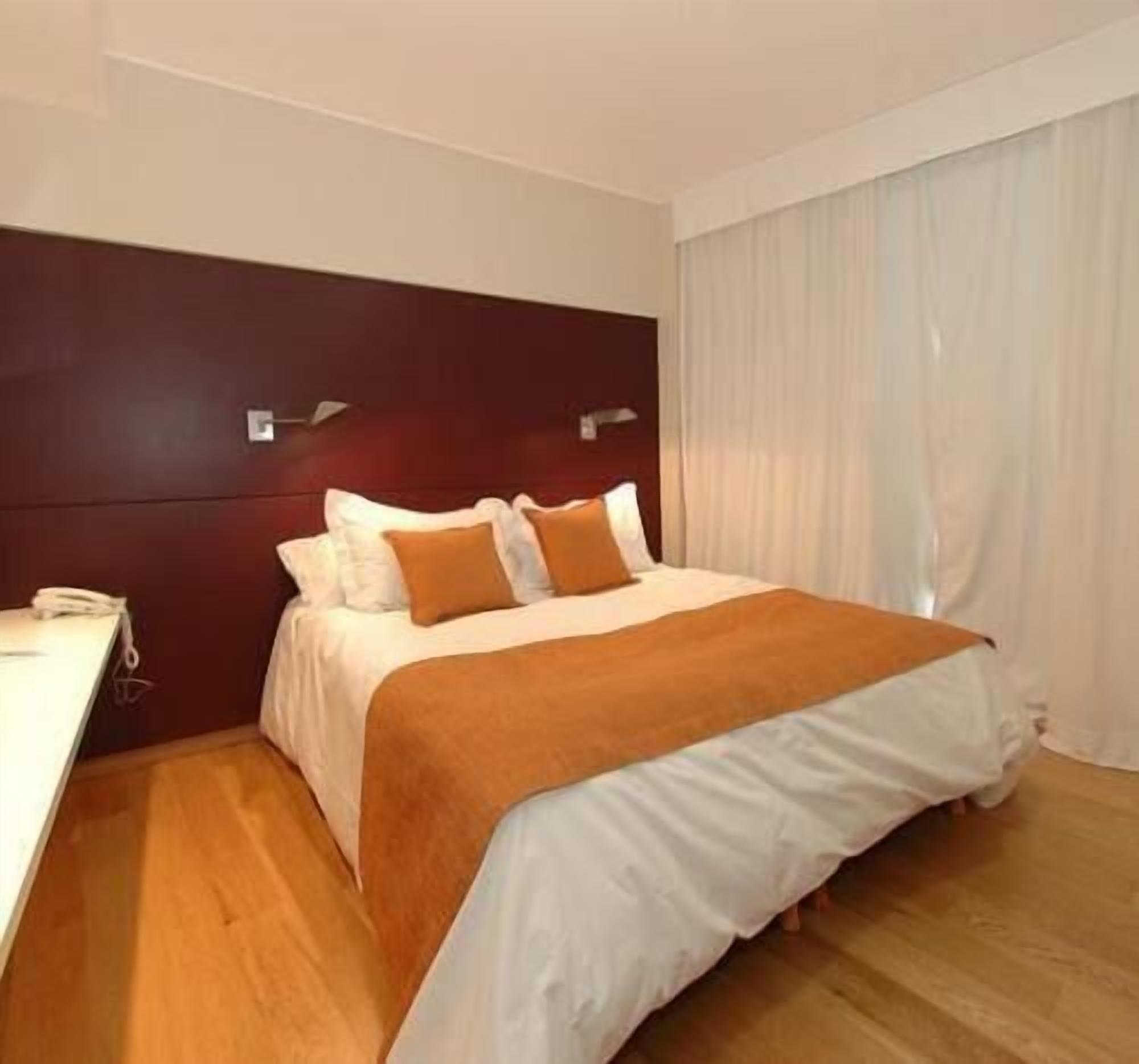 Premium bedding, down comforters, pillowtop beds, minibar