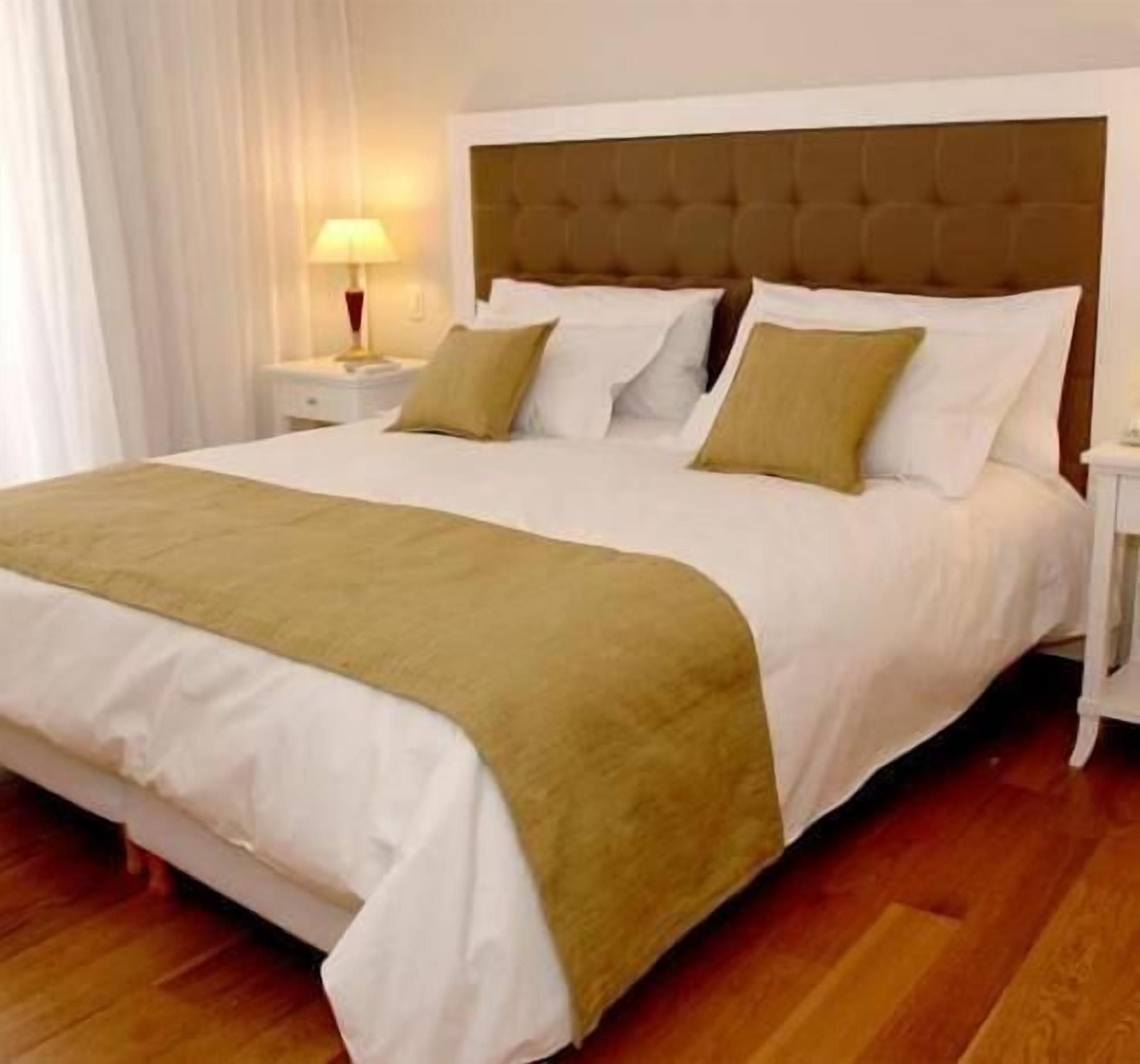 Premium bedding, down comforters, pillowtop beds, minibar