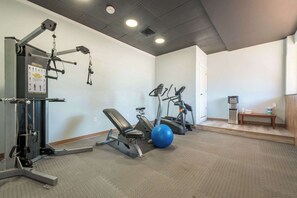 Stay active with a variety of exercise machines and ample space for stretching.