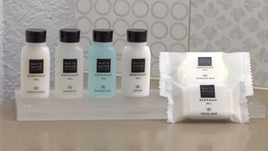 A display of White Water Collection products including conditioner, shampoo, shower gel, and lotion, along with a facial bar. - Country Inn & Suites by Radisson, Grand Forks, ND (Grand Forks)