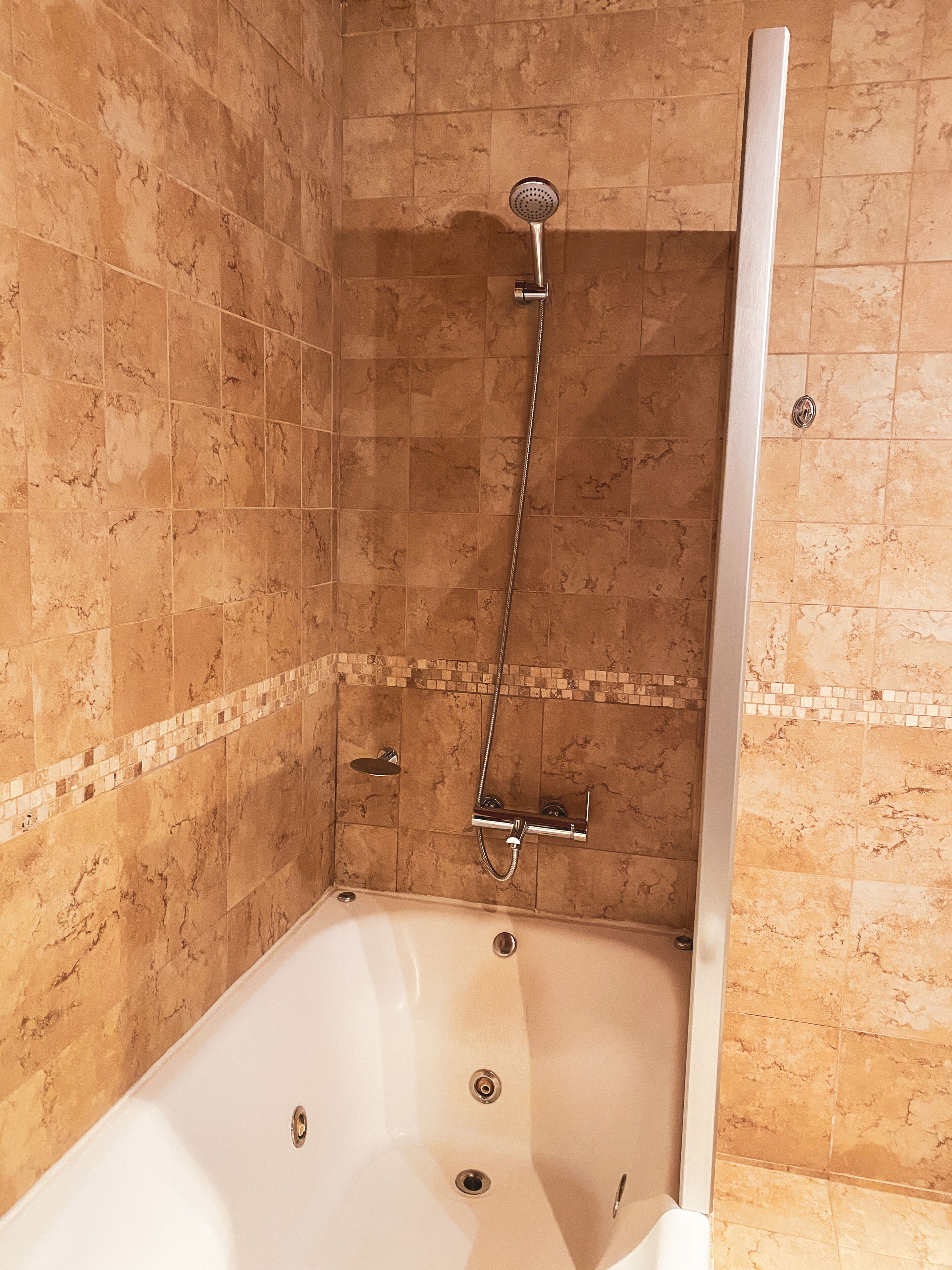 superior room, lake view | bathroom | combined shower/bathtub, deep-soaking bathtub, rainfall showerhead