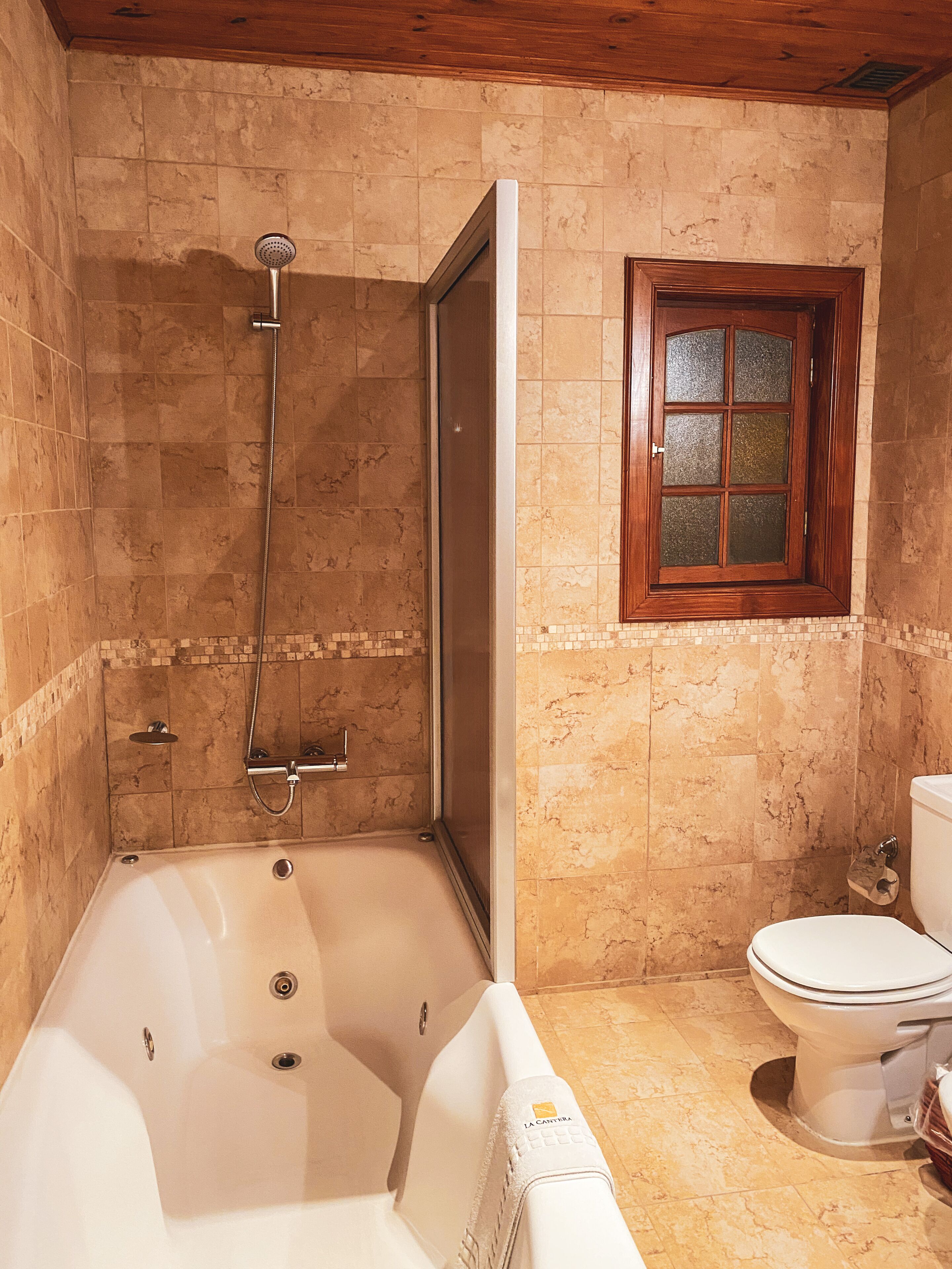 superior room, lake view | bathroom | combined shower/bathtub, deep-soaking bathtub, rainfall showerhead