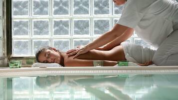 Guests can enjoy a rejuvenating massage on a treatment table, surrounded by a serene atmosphere.
