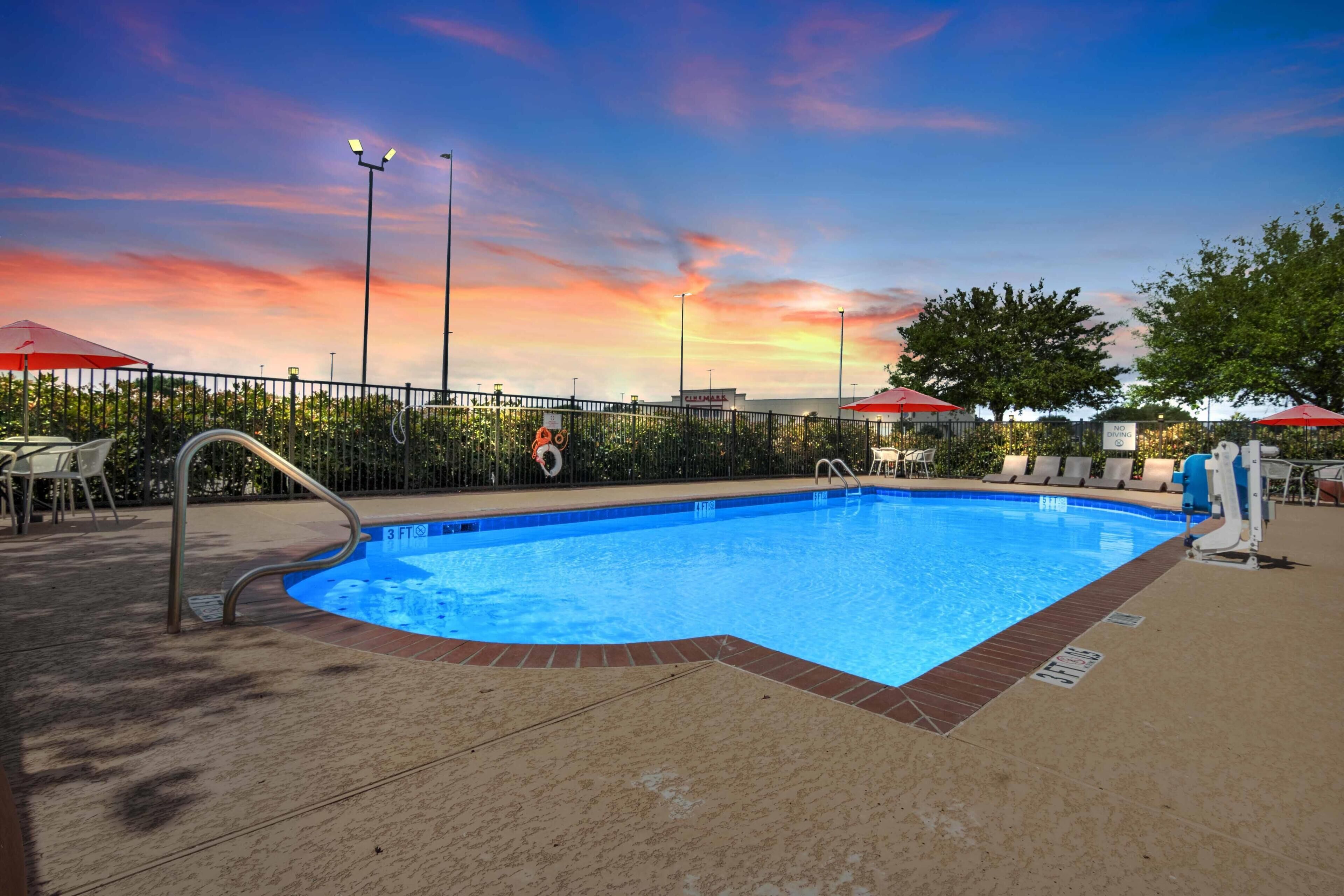 Outdoor pool, open 7 AM to 9 PM, pool umbrellas, sun loungers