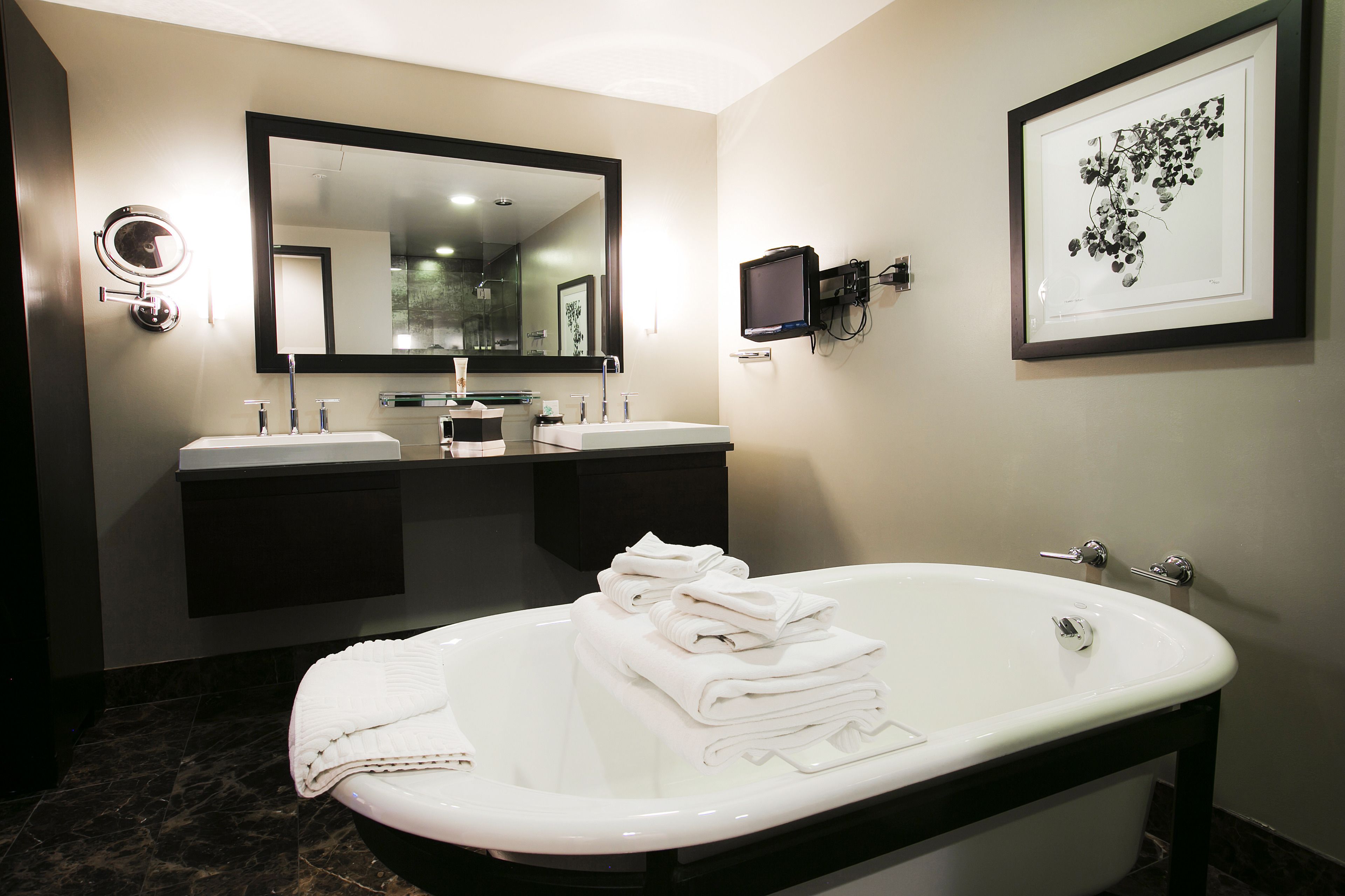 designer toiletries, hair dryer, towels