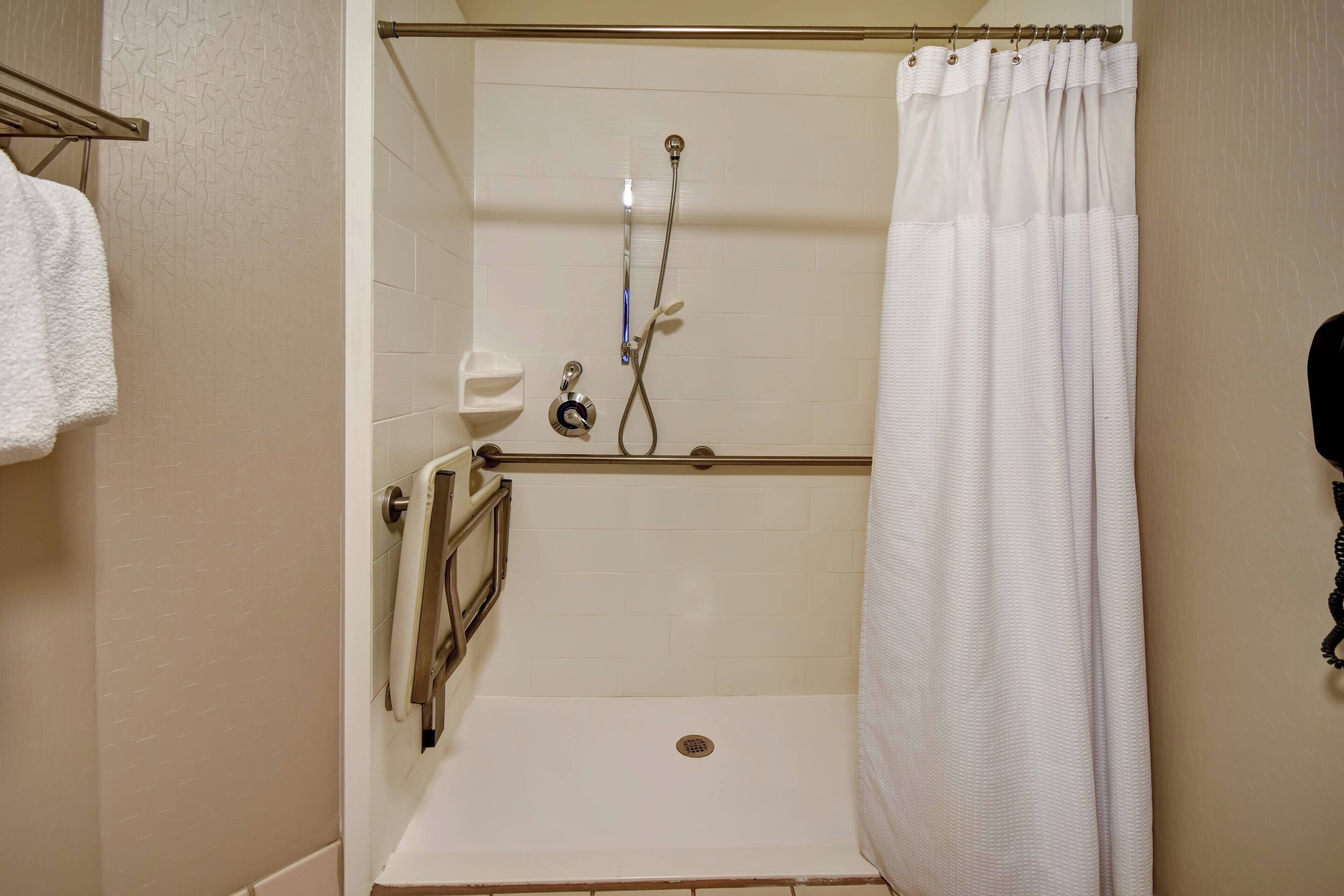 designer toiletries, hair dryer, towels