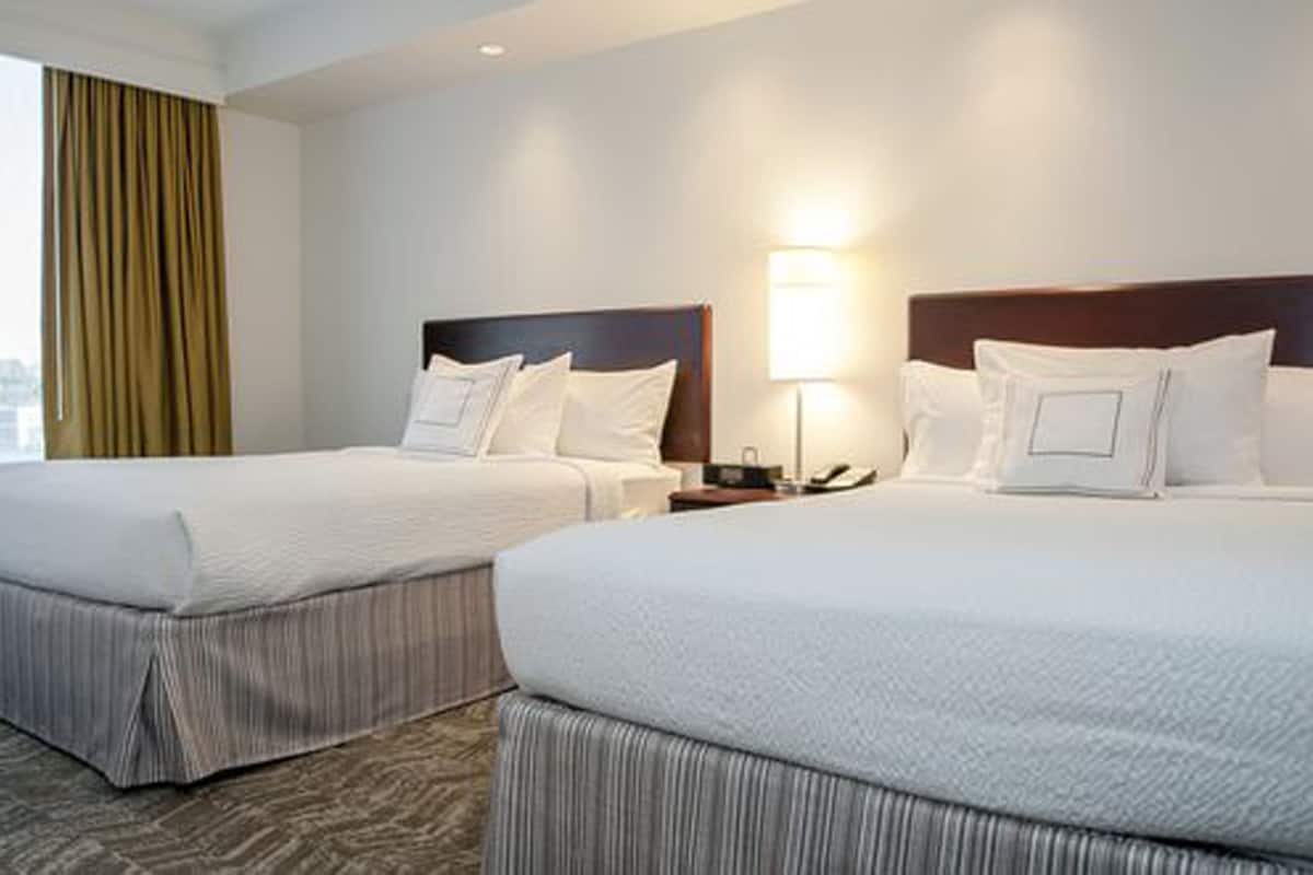 Premium bedding, pillow-top beds, desk, blackout curtains