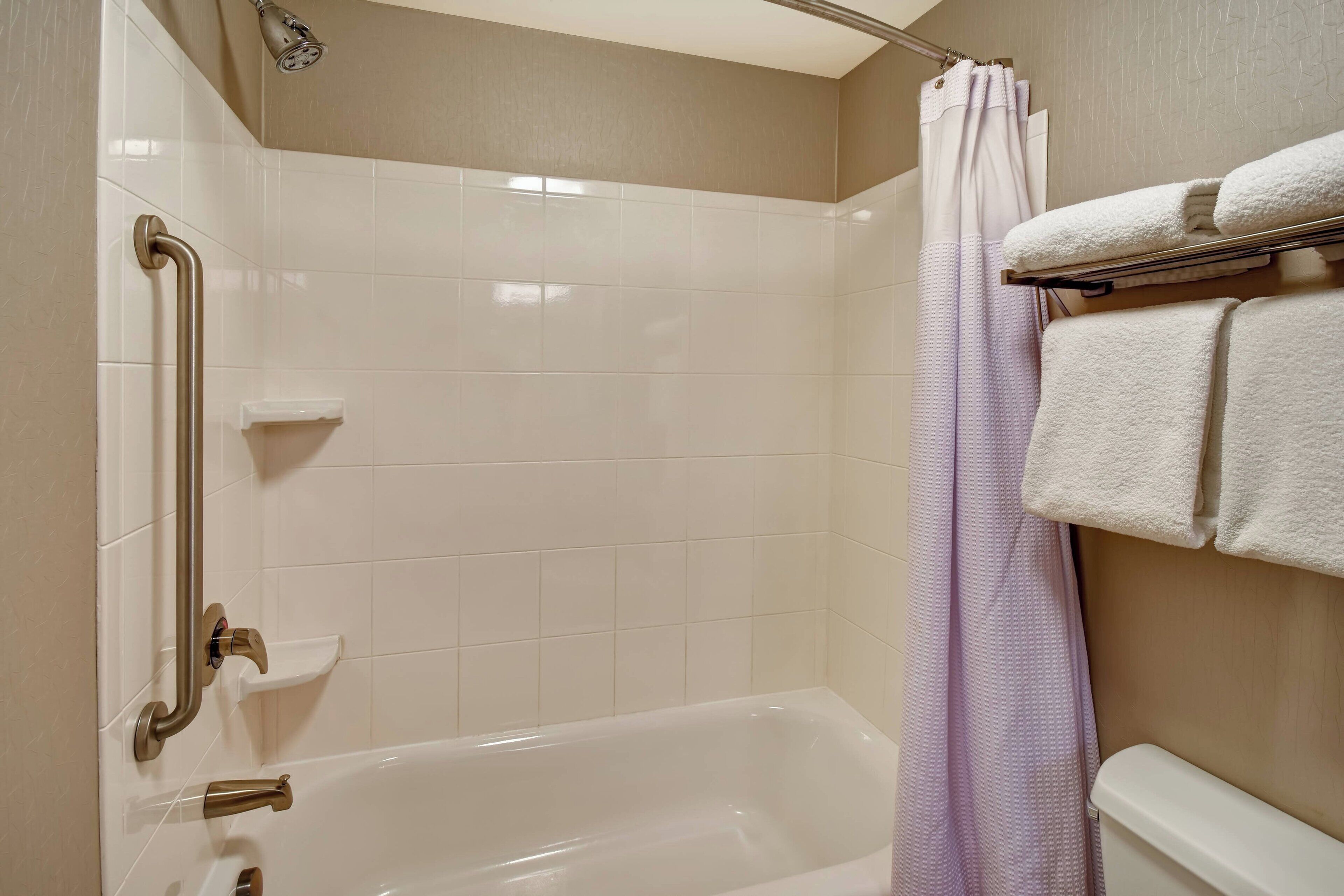 designer toiletries, hair dryer, towels