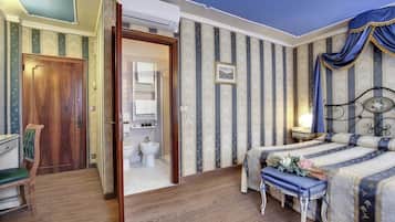 Quadruple Room | Minibar, in-room safe, desk, iron/ironing board