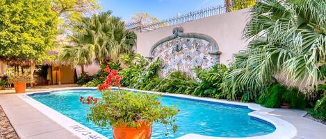 Outdoor pool, open 7:00 AM to 6:00 PM, pool loungers