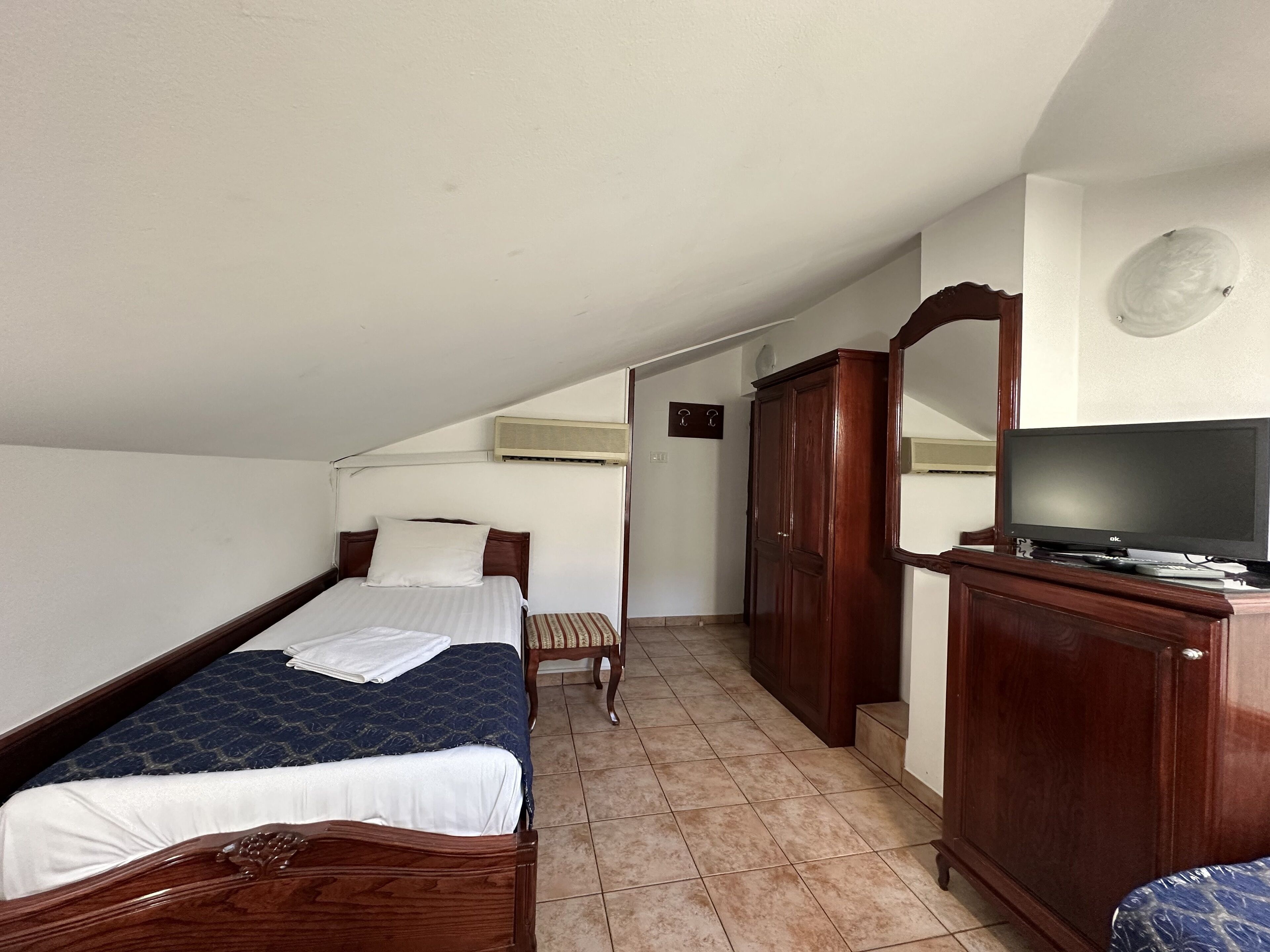 classic triple room, city view | in-room safe, individually decorated, soundproofing, iron/ironing board