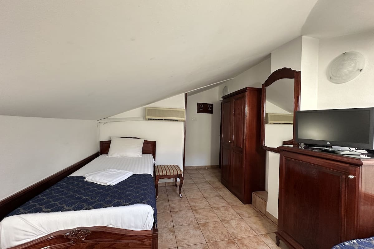 classic triple room, city view | in-room safe, individually decorated, soundproofing, iron/ironing board