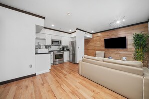 Deluxe One Bedroom King Suite | Living area | 42-inch plasma TV with cable channels, TV, iPod dock - Metropole Suites South Beach (Miami Beach)