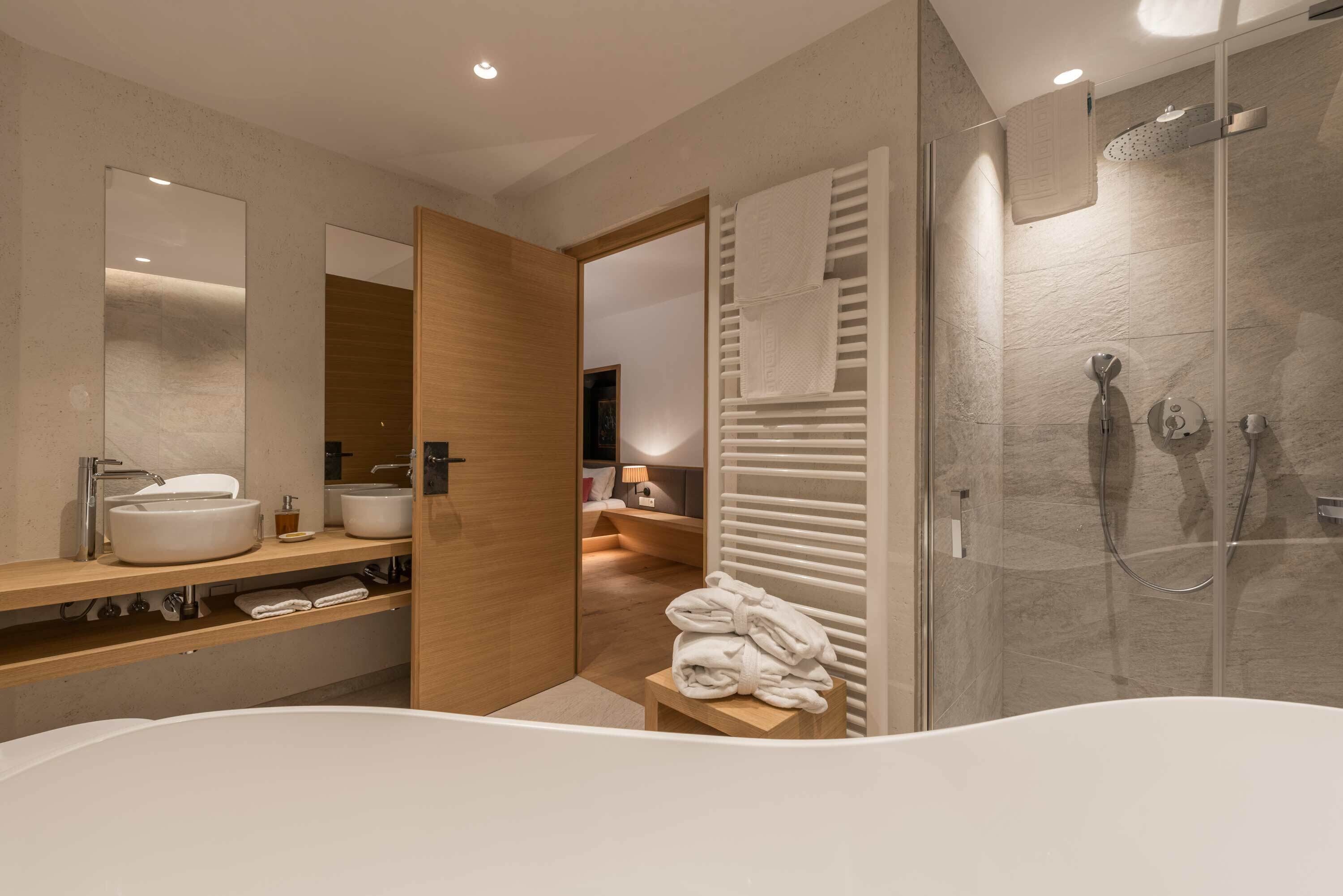 junior suite, 1 double bed | bathroom | separate bathtub and shower, hair dryer, bathrobes, towels