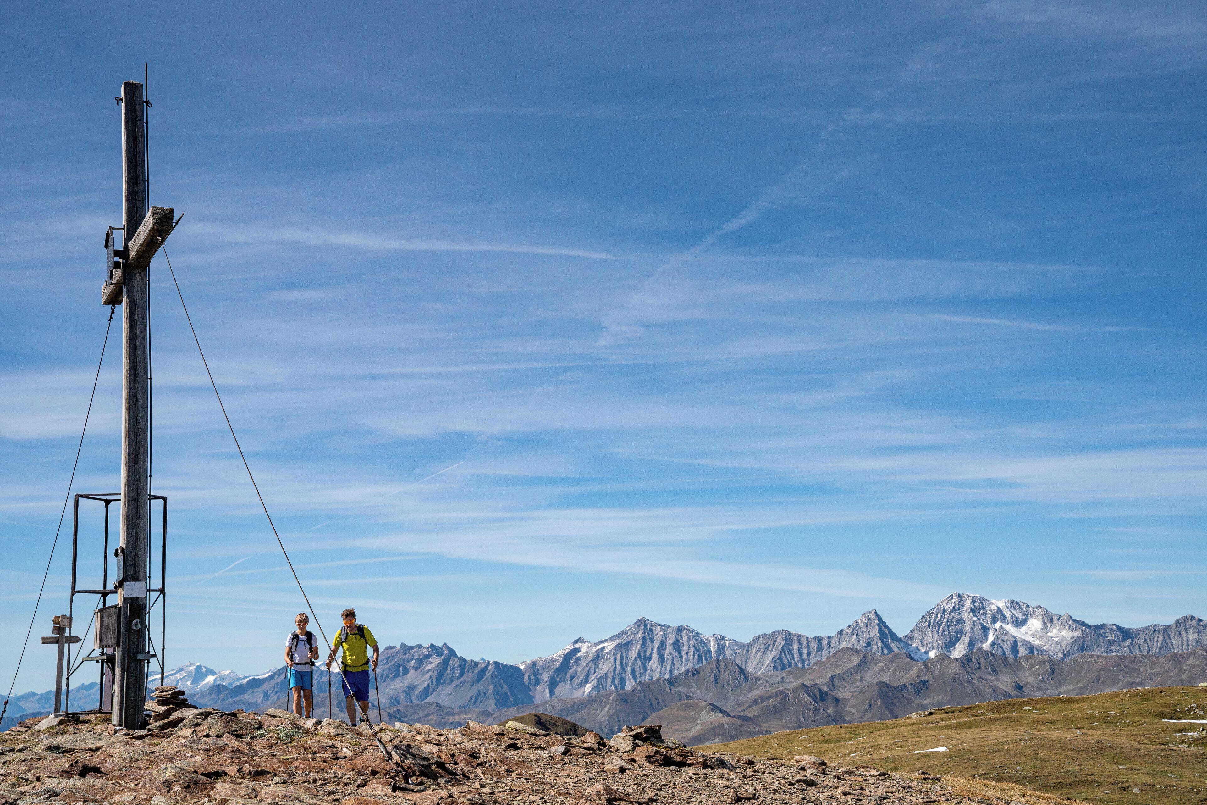 A mountain landscape with rocky terrain and a metal structure.