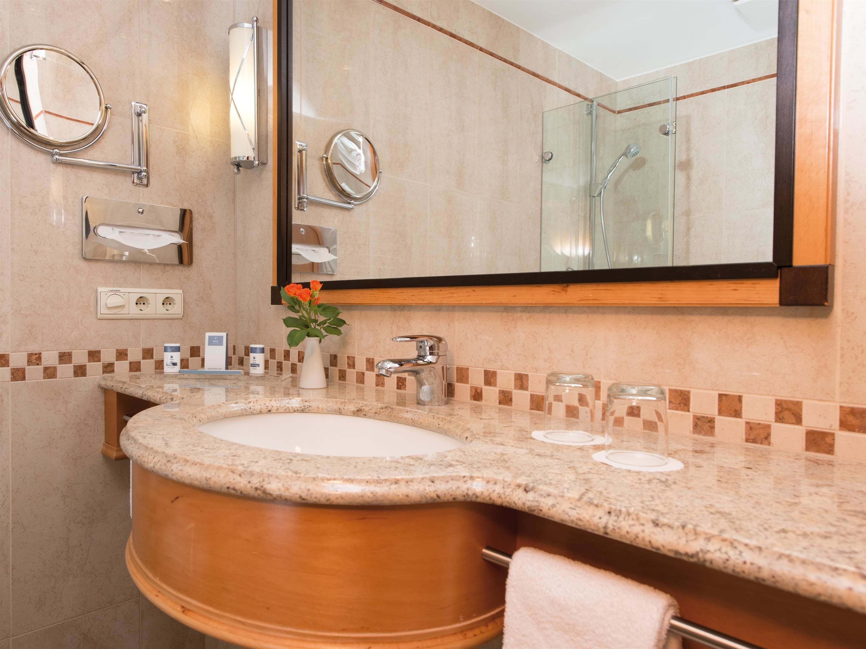 eco-friendly toiletries, hair dryer, bathrobes, slippers