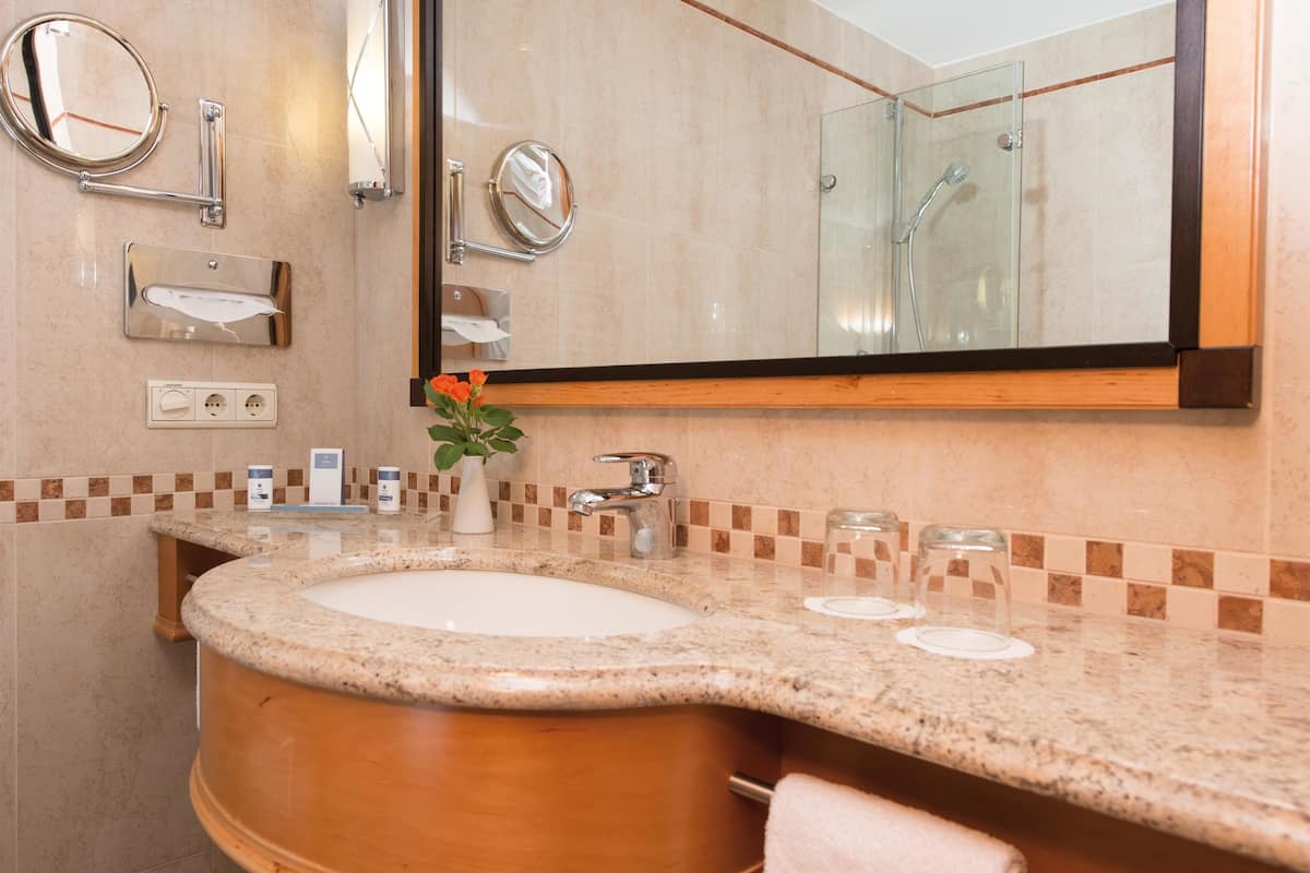 eco-friendly toiletries, hair dryer, bathrobes, slippers